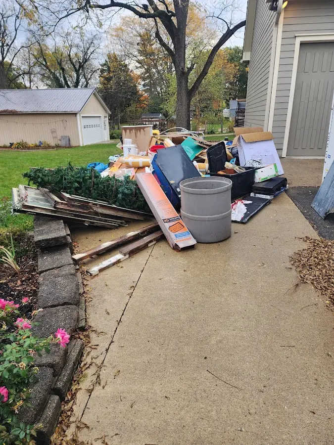 Dumpster being loaded with debris for 3 Yard Dumpster Rental in Hobe Sound